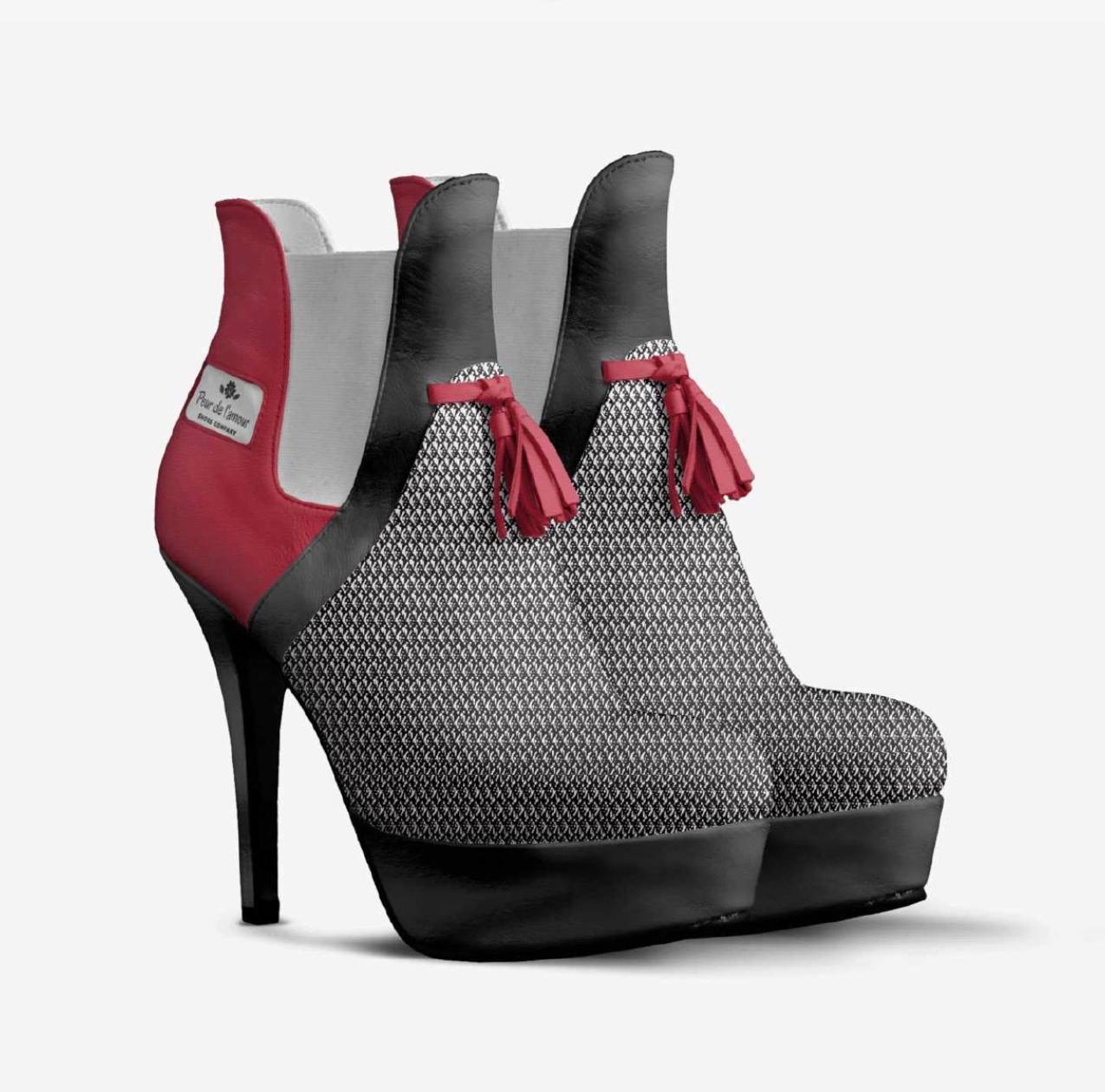 Chic black and red high heel boots showcasing a fashionable design with a glossy finish.
